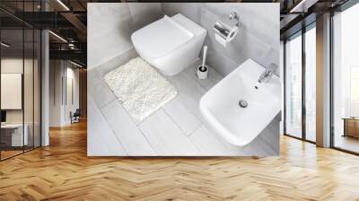 Ceramic bidet and closed toilet at bathroom interior Wall mural