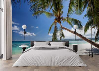 Pristine beach with palm trees, white sand and turquoise tropical sea. Travel destination Wall mural