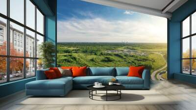 Summer forest and green field near city. Panorama Wall mural