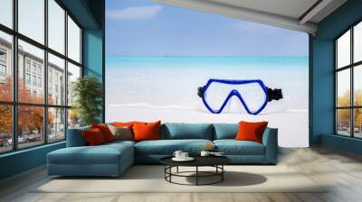 Swimming mask on white sandy seashore Wall mural