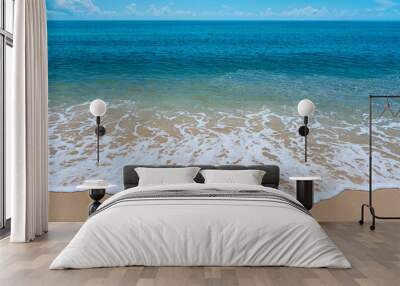 blue sea wave on the yellow sand with white bubbles Wall mural