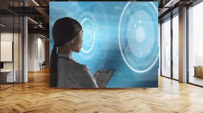 Abstract health care and medical engineering concept. A woman health care professional, or scientist, or bio engineer, is using a futuristic, innovative technology holographic machine  Wall mural