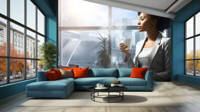 beautiful young African woman with a cup of coffee in her hands. healthy and healthy drinks Wall mural