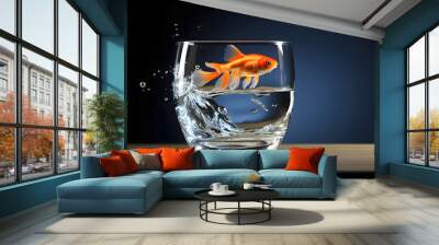 Goldfish jumping out of the water in a fishbowl. water world. fauna and biology. concept of achieving goal and freedom Wall mural