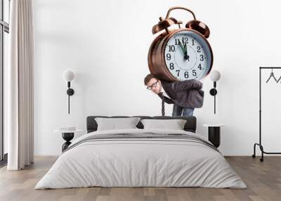 Time pressure - A man is carrying a large alarm clock on his back Wall mural