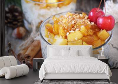 Two glass of rice milk cream  pudding with caramelized apple and praline, New Year dessert,  christmas decoration Wall mural