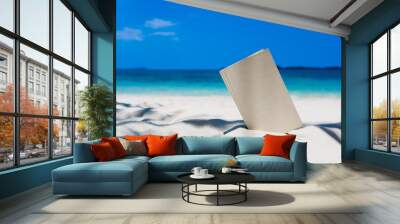 Book on the Beautiful ocean beach On the outdoor blurred sea background Wall mural