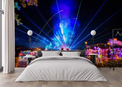 Outdoor night music party with laser lights and fire Wall mural