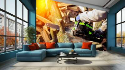 Gasoline Chainsaw. Close-up of woodcutter sawing chain saw in motion, sawdust fly. Concept is to bring down, pile trees. Wall mural