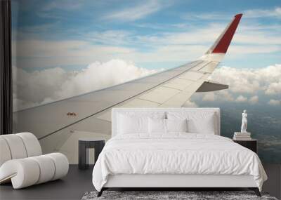 airplane wing on blue sky background Wall mural