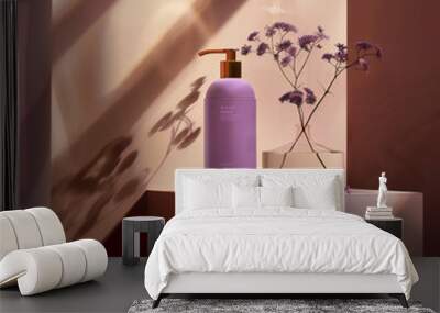 A bottle of purple lotion on a orange background with purple flowers. Wall mural