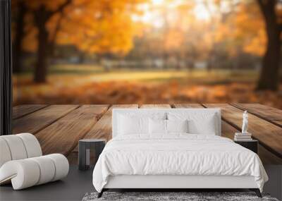 A plain wooden table with a blurry autumn scene behind it, perfect for showcasing your products. Wall mural