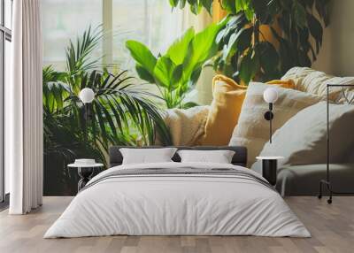 A sofa inside a living room, next to some houseplants. Wall mural