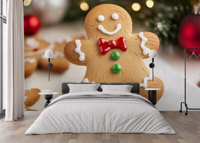 Meet the friendly Gingerbread Man! Wearing a bow tie and decorated with icing, he's a festive treat for Christmas. This classic sweet biscuit is sure to bring joy to your holiday. Wall mural