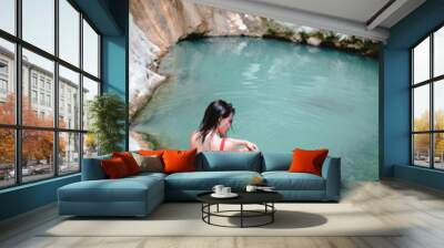 woman in red swimsuit Dimosari waterfall at Lefkada island Greece Wall mural