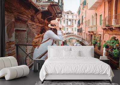 woman looking at canal with gandola Wall mural