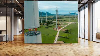 Aerial view of wind turbine under construction with a crane to generate sustainable alternative energy to reduce global warming and climate change. Sustainable growth. Wall mural