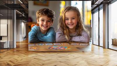 Happy Kids Playing Card Game Together at Home Wall mural