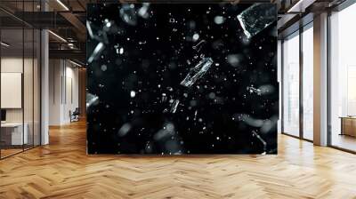 Shattered Glass Fragments Falling on Black Background Wall mural