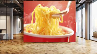 A spoonful of noodles is being scooped out of a red bowl Wall mural