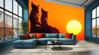 Two statues of Egyptian gods are sitting on a wall Wall mural