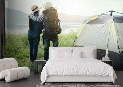 Couple travelers with backpacks relaxing mountain nature and enjoying view, freedom and active lifestyle concept. Wall mural