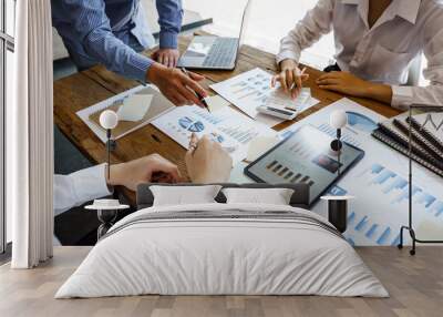 Team work discussing in valuation data in meeting room, three business people with accounting paper charts. Wall mural