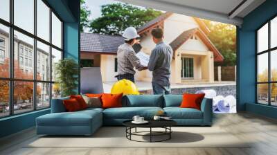 Two business man professional engineer worker at the house building. Wall mural