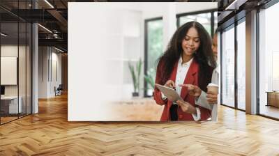 Young diverse african american female coworkers working together on start up project. Business people meeting around a boardroom table discussing creative concept Wall mural