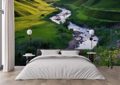 A bubbling stream winds its way through a lush valley surrounded by rolling hills blanketed in wildflowers.  Wall mural