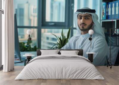 A businessman Emirati young man portrait in his office Wall mural