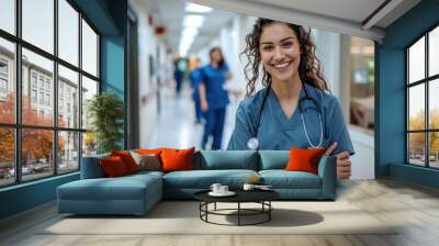 A happy medical woman nurse stands in hospital Wall mural