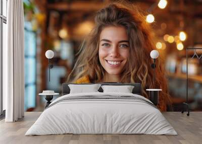 A happy young beautiful woman holding a cup of morning coffee Wall mural