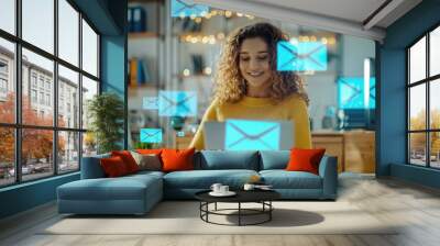 A happy young woman reading an email from a company at her office desk Wall mural