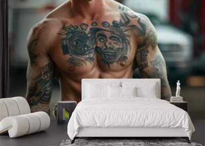 A tattooed firefighter showing athletic abs, muscle arms and muscle chest Wall mural