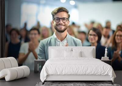 A young man startupper is clapping on a business conference Wall mural