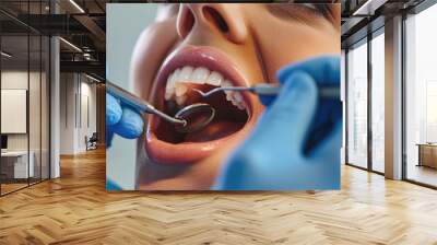 Dentist is taking care of the client's teeth Wall mural