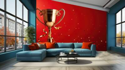 Golden trophy and streamers, red background with copy space Wall mural