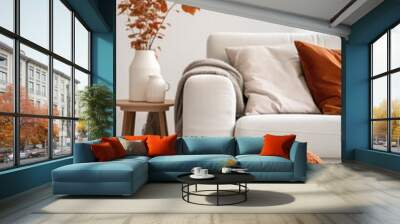 Scandinavian home interior design of modern living room. Knitted pouf, fabric sofa with blanket and pillows Wall mural