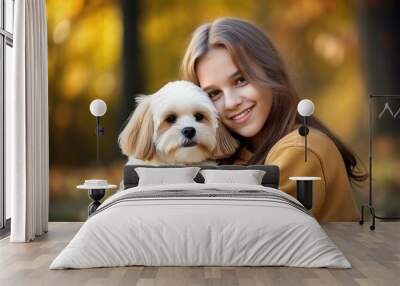 Teenage girl hugging her lovely dog Wall mural