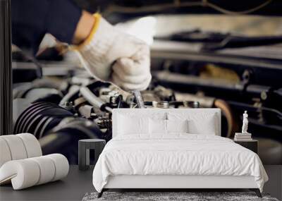 Auto mechanic Preparing For the work. Mechanic with Stainless Steel Wrench in Hand.Close up of hands mechanic doing car service and maintenance. Wall mural