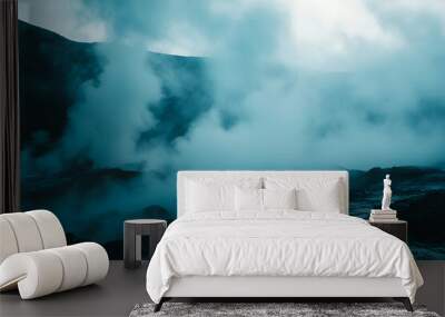 Moody volcanic landscape with thick steam and rugged terrain, creating an ethereal and dramatic natural scene. Wall mural