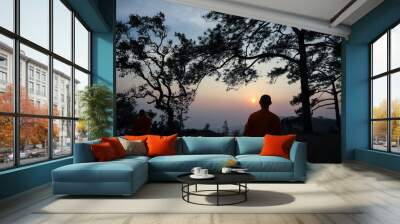 silhouette of man at sunset Wall mural