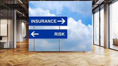 Insurance and risk on blue road sign Wall mural