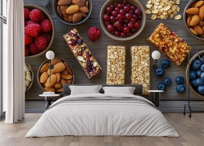 A colorful arrangement of healthy snacks including fruits, nuts, and granola bars. Wall mural