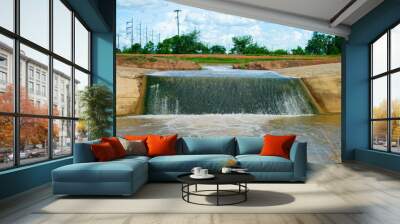 Overflow concrete canal with blue sky in Thailand. Wall mural