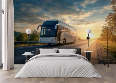 Modern white intercity bus on a scenic highway with the warmth of a sunset, perfect for long-distance travel and countryside touring. Wall mural