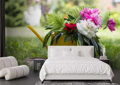 bouquet of flowers in a yellow bailer Wall mural