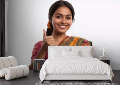 Indian housewife showing thumb up isolated on white background Wall mural