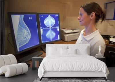 Radiology technician looking at mammography Wall mural